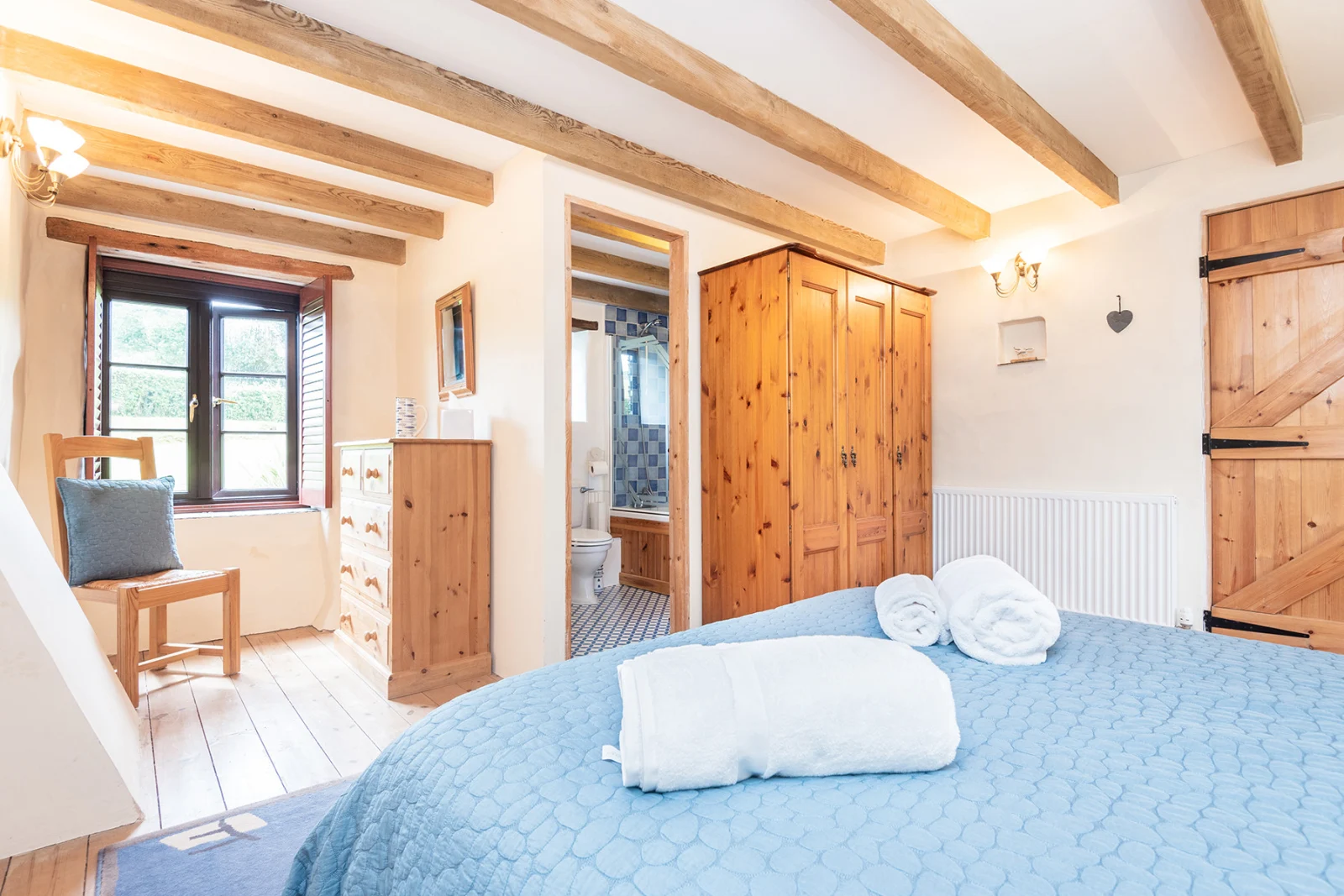 The second huge bedroom with en-suite and French windows to the decked terrace