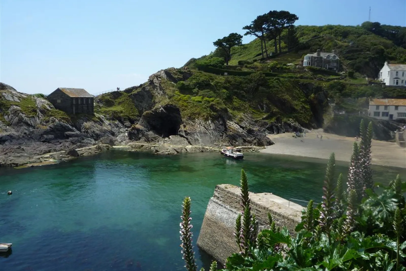 The little tidal beach and caves in the mouth of Polperro