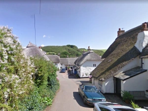 The view into the little square of thatched cottages. 