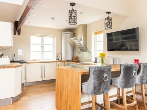 Large fully-equipped kitchen with breakfast bar.