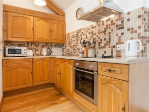The well equipped kitchen with dishwasher