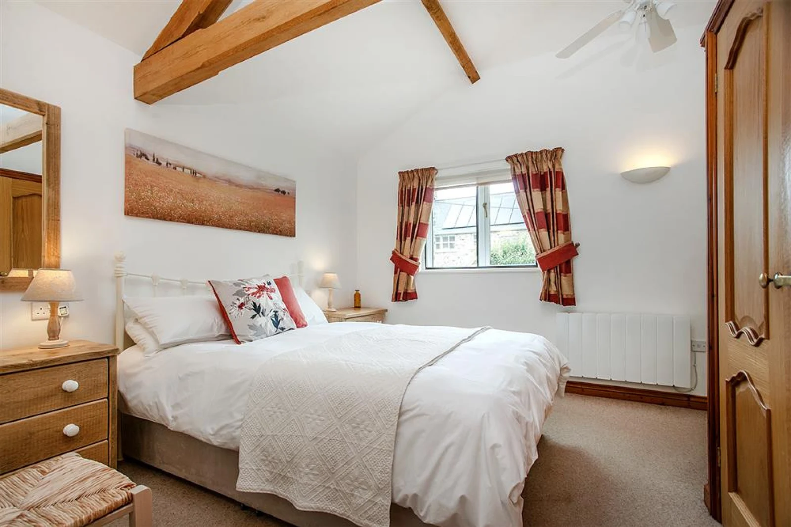 The bedroom has an en-suite shower room
