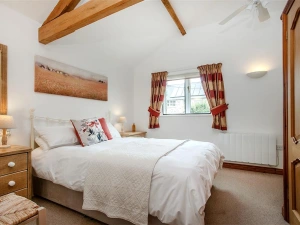 The bedroom has an en-suite shower room