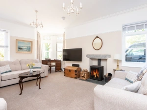 Beautiful Lounge with modern comfortable sofa's, woodburner, desk, Smart TV.
