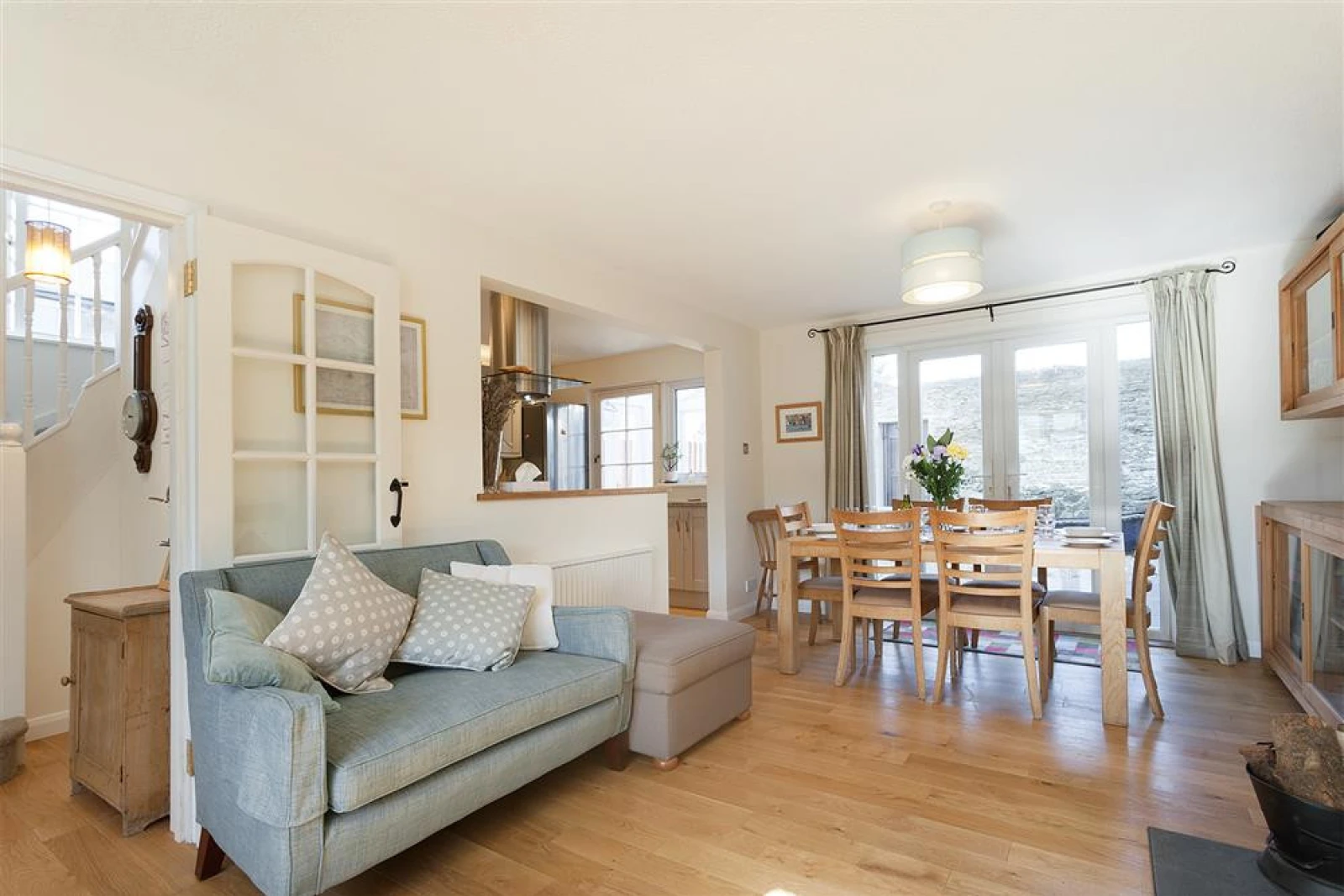 Looking from the seating area to the kitchen and dining area.