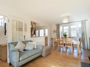 Looking from the seating area to the kitchen and dining area.
