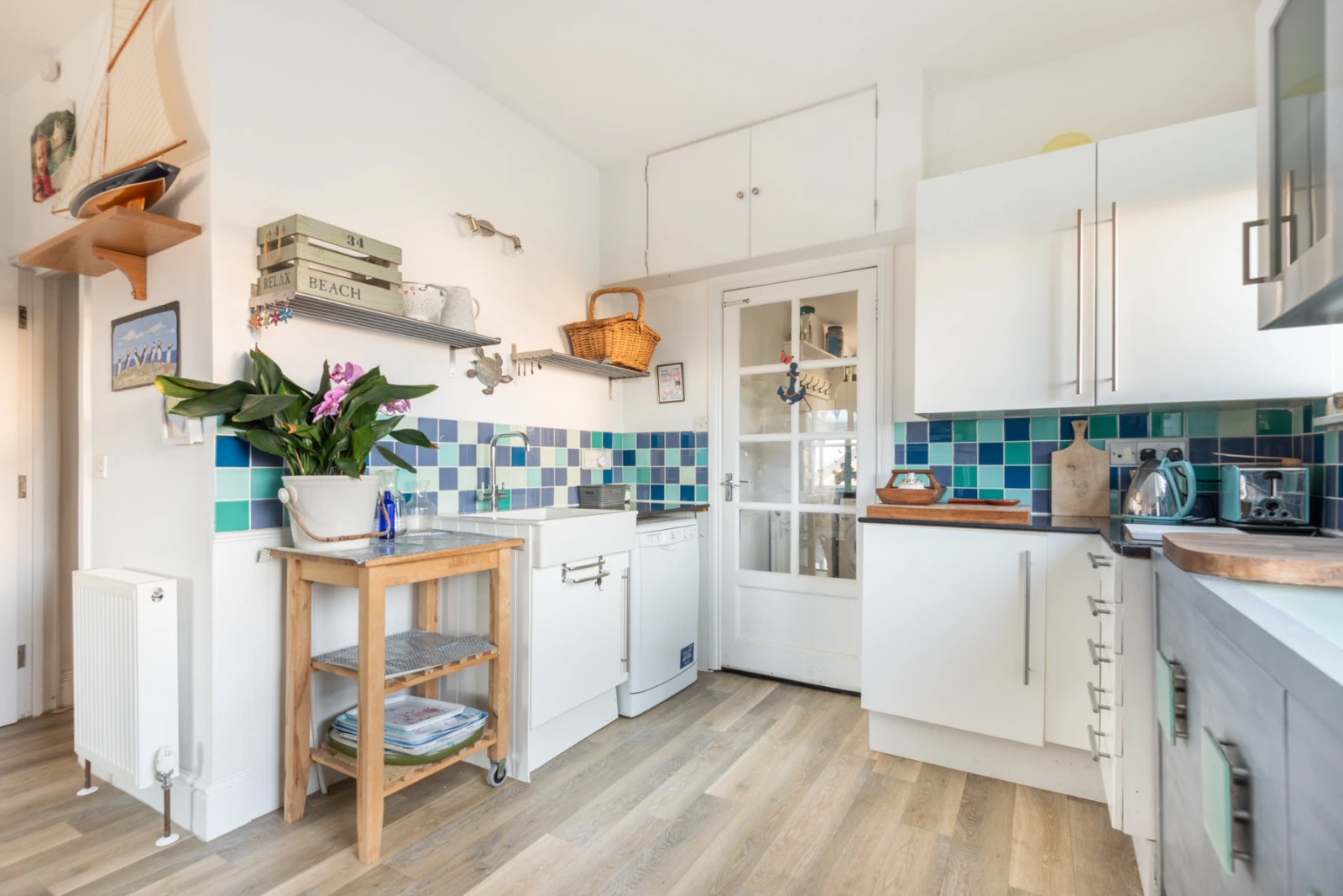 The light and bright kitchen is well equipped