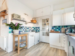 The light and bright kitchen is well equipped