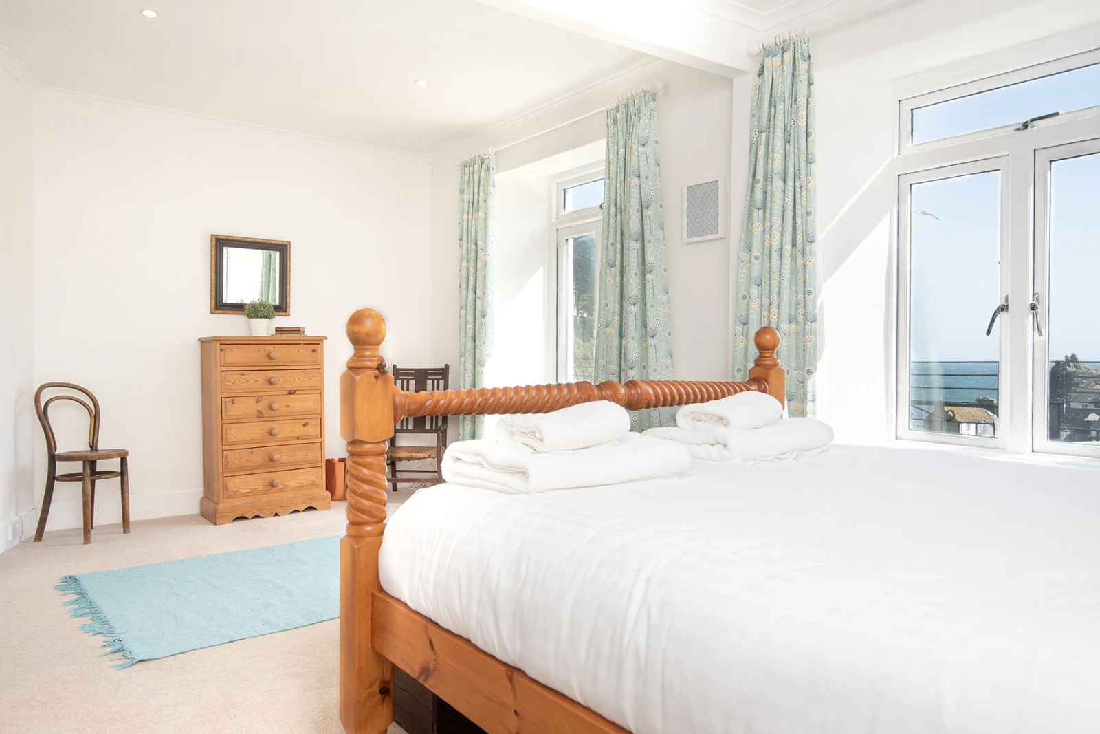 The master bedroom with door to top floor balcony