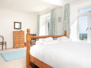 The master bedroom with door to top floor balcony