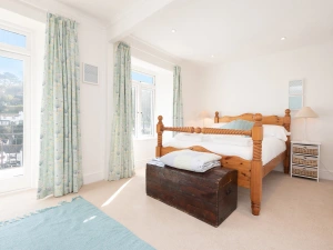The master bedroom with the French windows onto the balcony