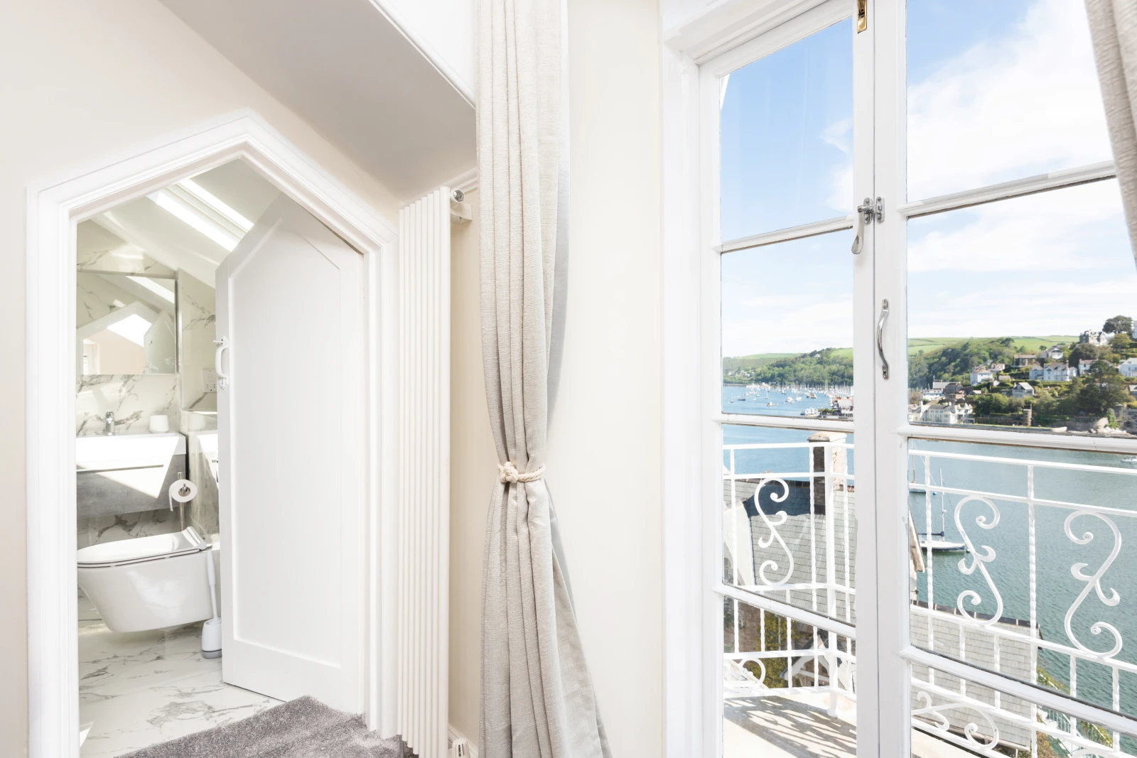French doors to master bedroom's balcony and Jack and Jill door to family bathroom.