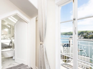 French doors to master bedroom's balcony and Jack and Jill door to family bathroom.
