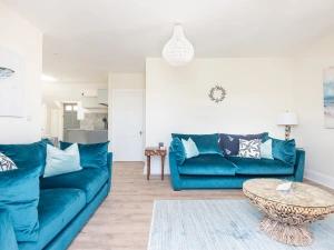 Living area through to contemporary kitchen.