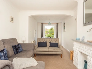 The comfortable lounge in this 3 bed holiday home in Chillington, Devon