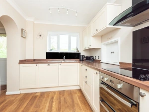 Well equipped kitchen with views over the garden and out over fields beyond in South Devon
