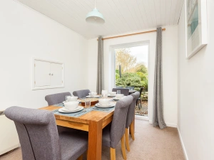 The dining area with doors out to the garden -great for summer holidays in South Devon