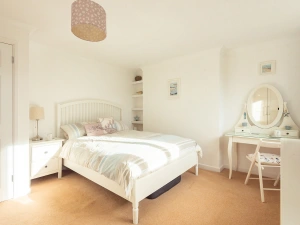 The light and airy master bedroom in this holiday home near Kingsbridge, Devon.