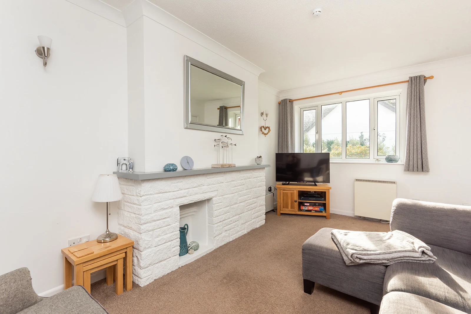 Light and airy lounge area looks out on to the quiet residential street in Chillington