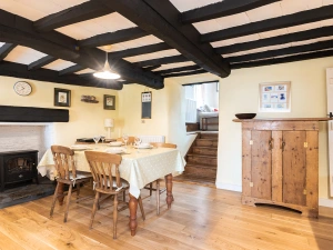 the dining area in this traditional cottage