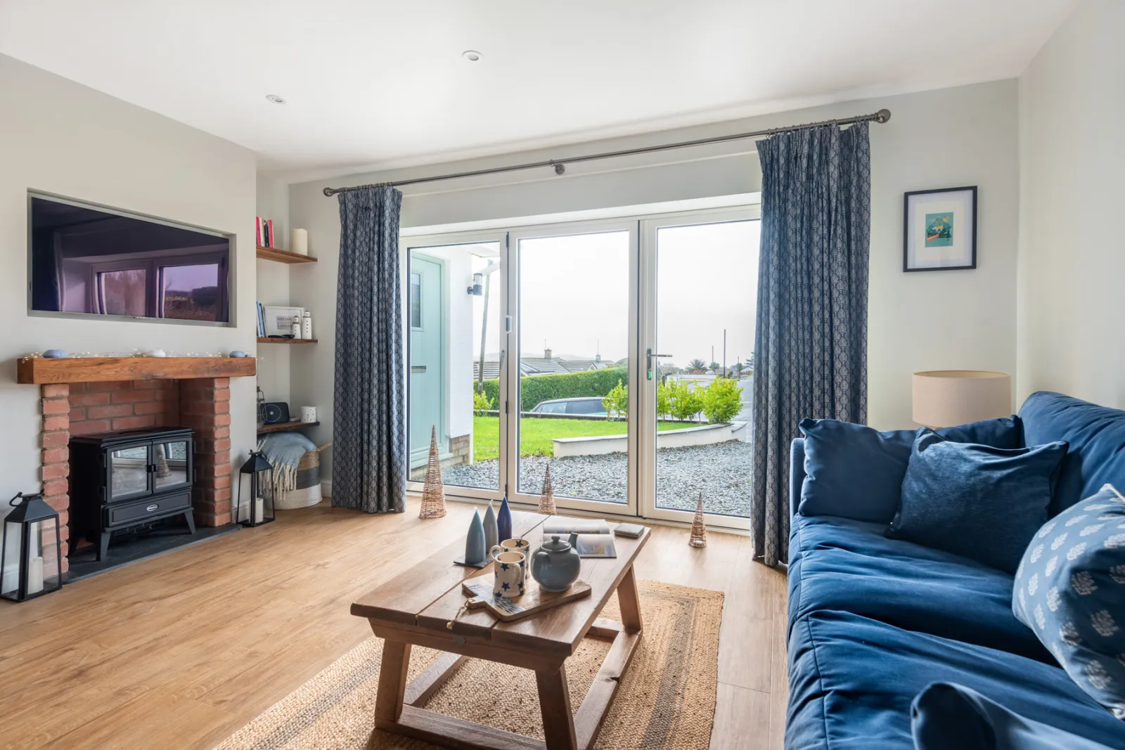 Lounge area with patio doors to driveway and front garden