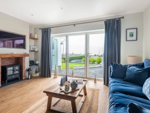 Lounge area with patio doors to driveway and front garden
