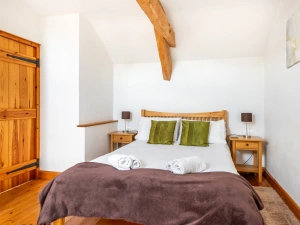 Bedroom 1 with a double and single bed.