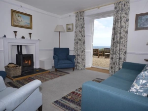 The sitting room with doors to the front terrace.