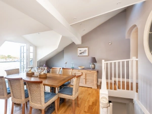 Separate dining room with table and seating for 8.