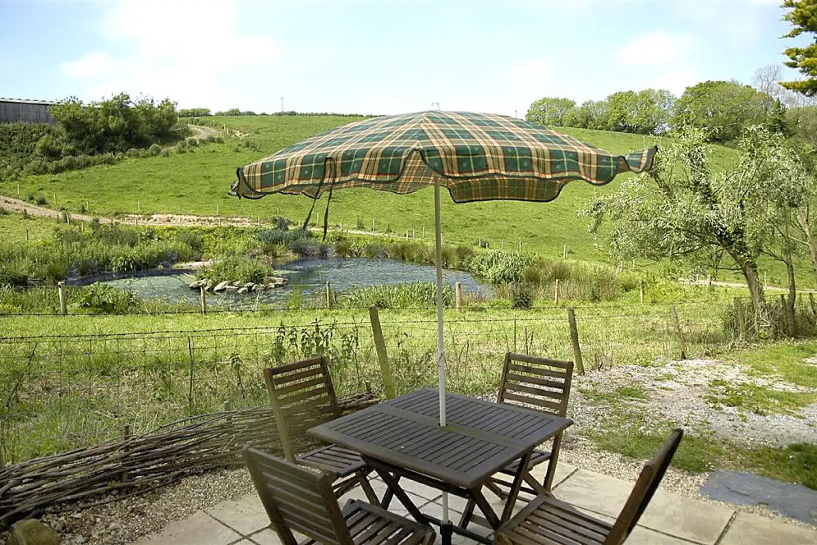 The patio overlooking the neighbouring pond