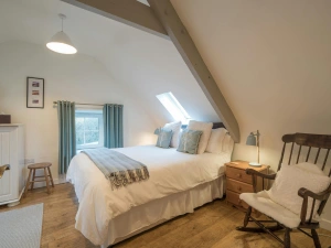 King size bed , rocking chair, chest of drawers with lamp, small stool