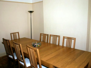 Separate dining room - table for eight with corner standard lamp