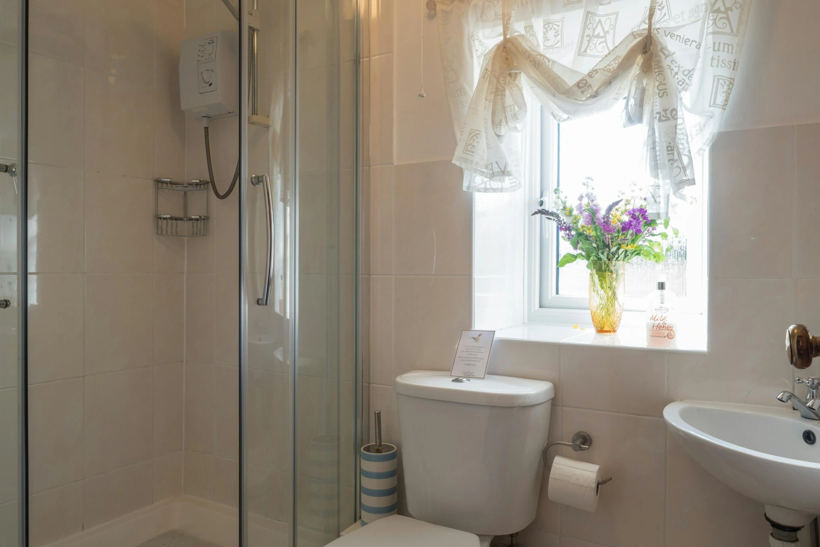 First floor bathroom: walk in shower, wash hand basin, WC and window