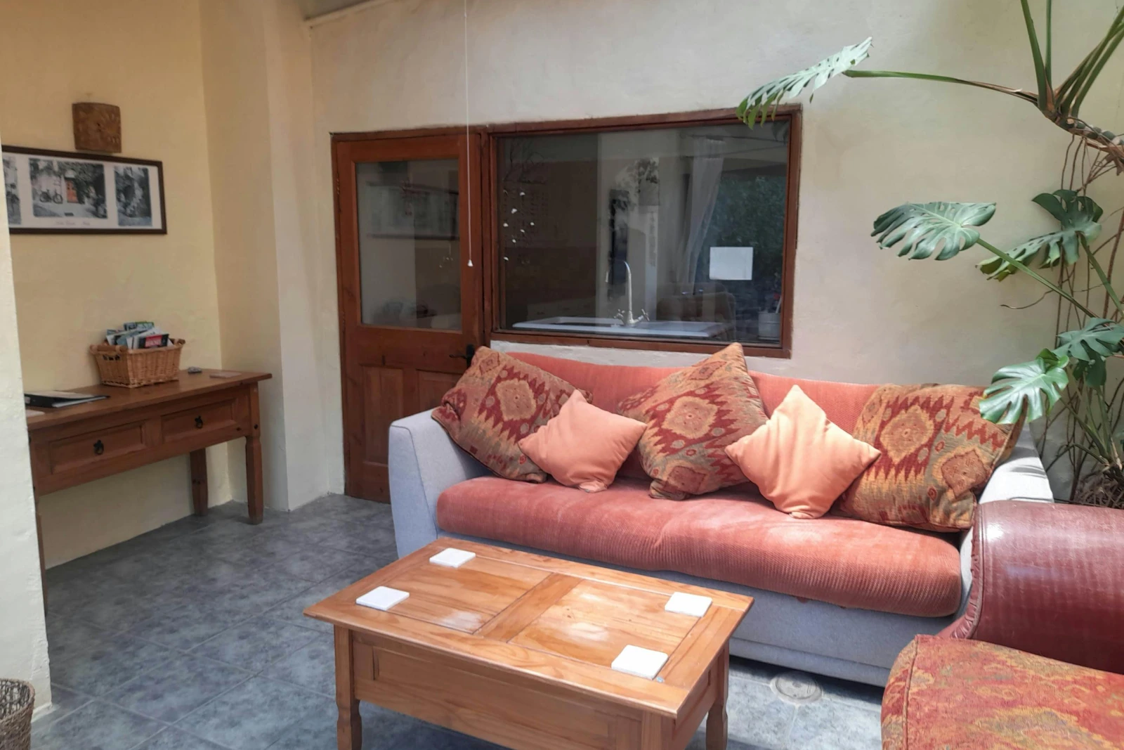 Sitting area at Uplands with sofa, coffee table and side unit