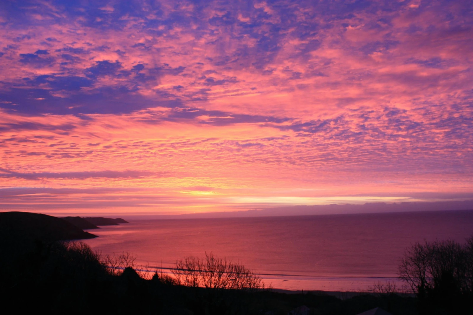 Sunset over Freshwater East Bay