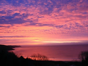 Sunset over Freshwater East Bay