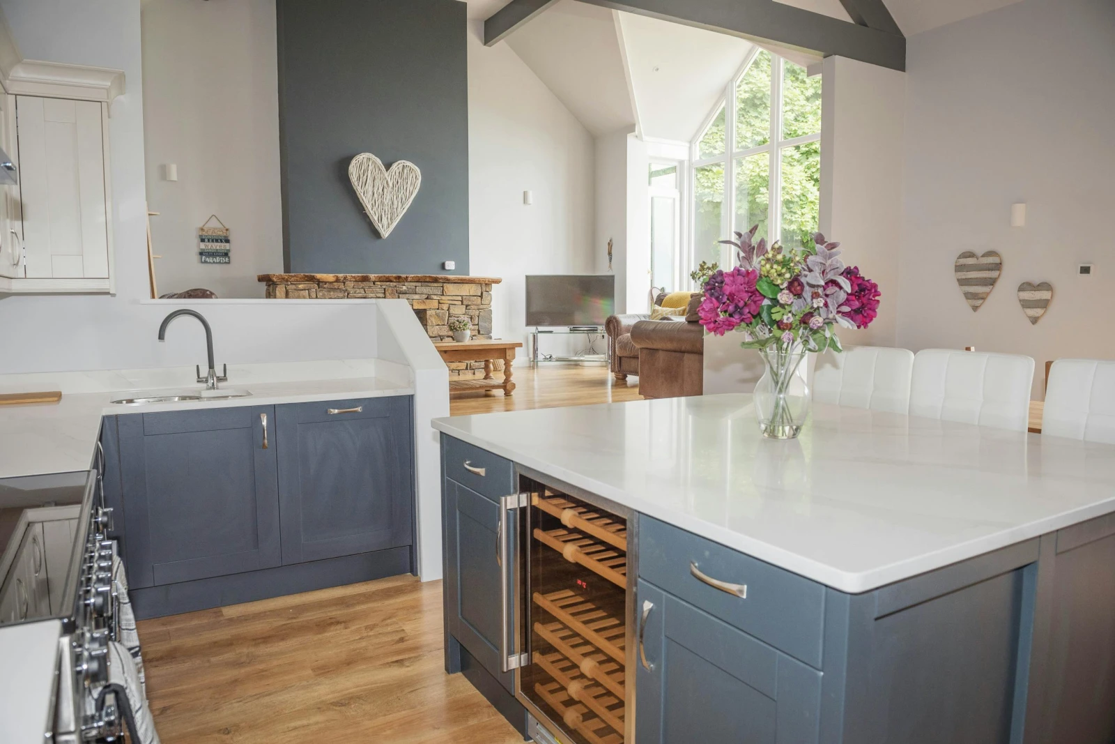 Kitchen with range cooker, sink and kitchen island
