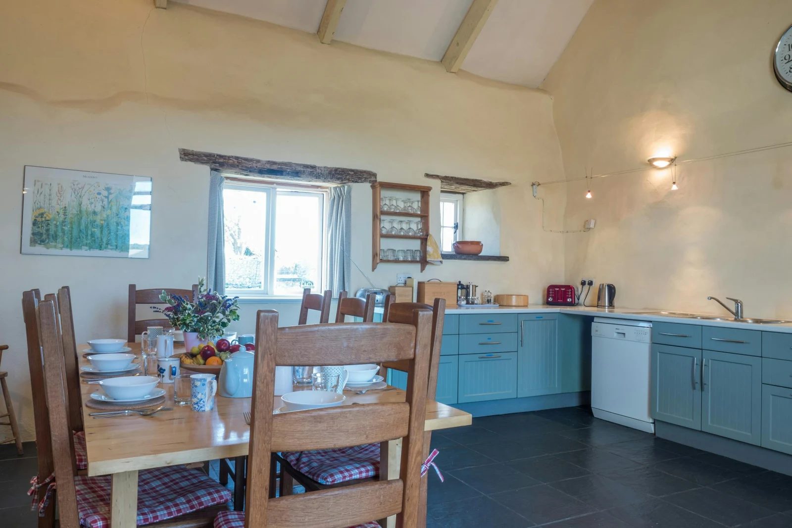 Fitted kitchen/dining area with table and eight chairs