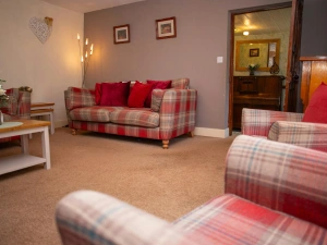 Sofa, armchairs, floor lamp, nest of tables and coffee table