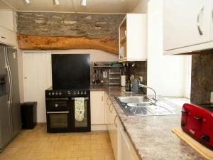 Kitchen with range cooker and American style fridge/freezer, toaster and kettle