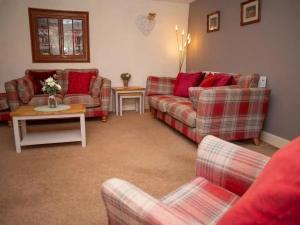 Two sofas, armchair, coffee table, nest of tables and floor lamp