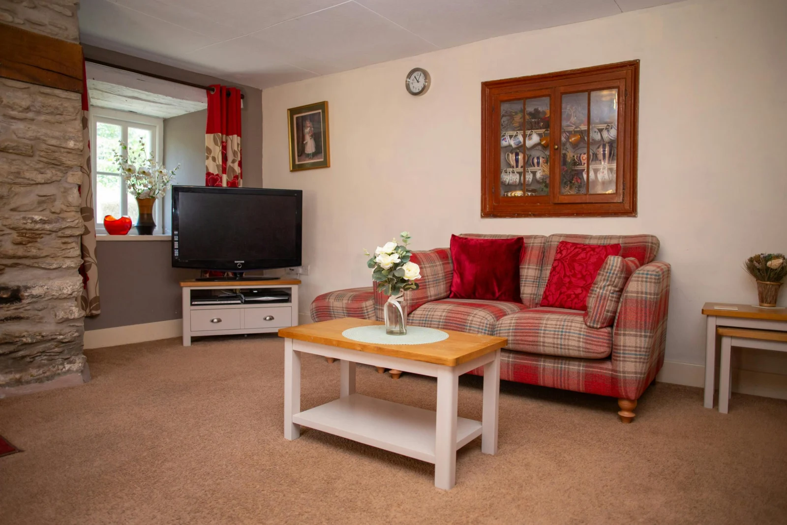 Sofa, coffee table, nest of tables and TV on unit