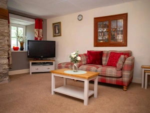 Sofa, coffee table, nest of tables and TV on unit