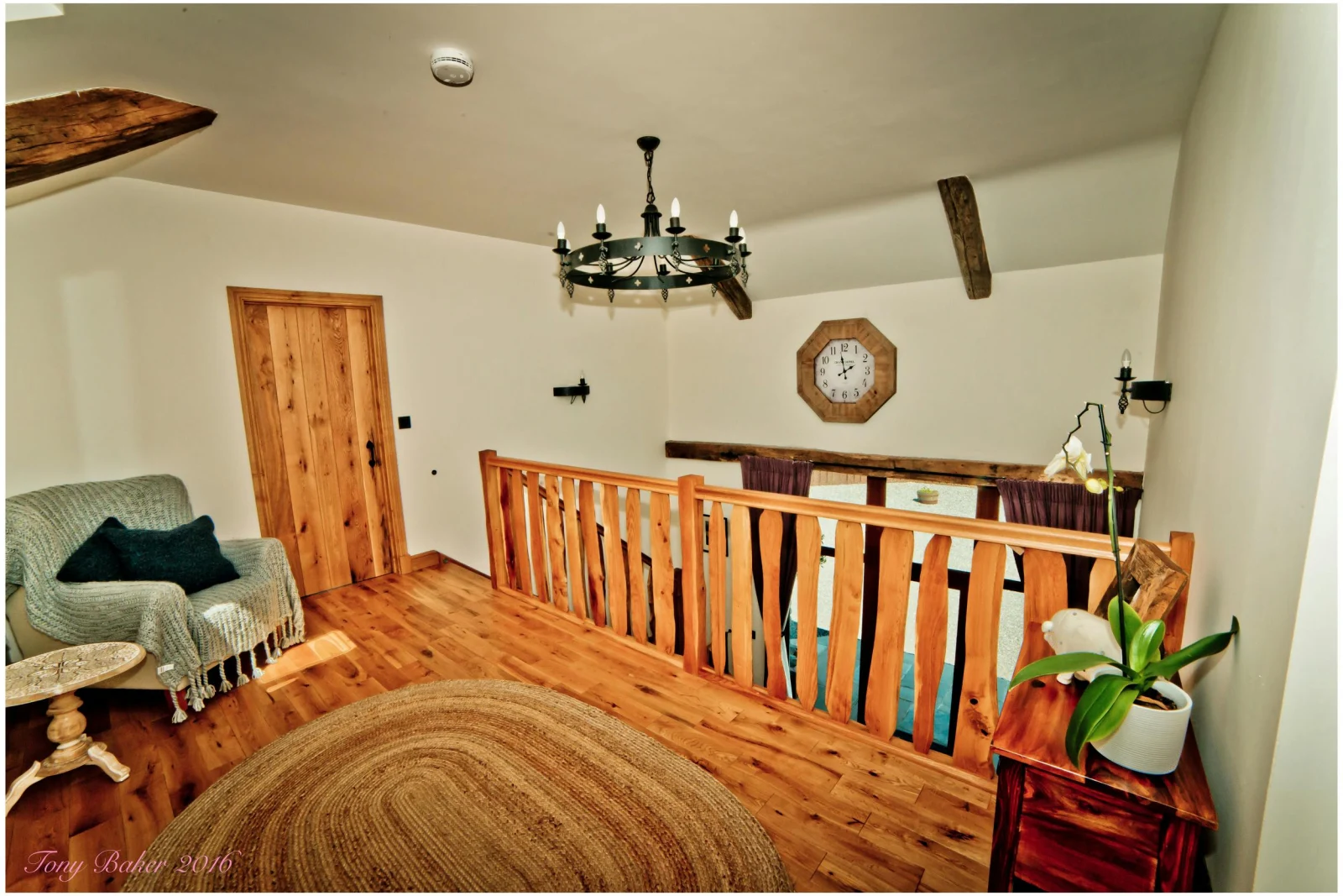 Mezzanine living area with armchair and small table