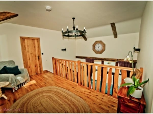 Mezzanine living area with armchair and small table