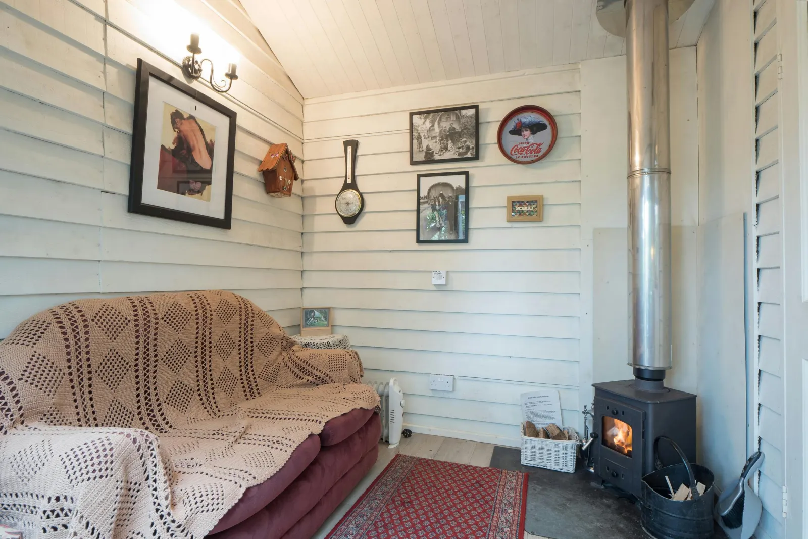 Seating area with sofa and log burner