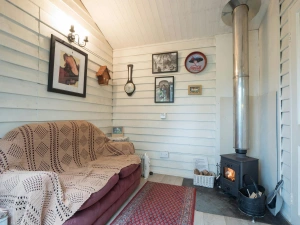 Seating area with sofa and log burner