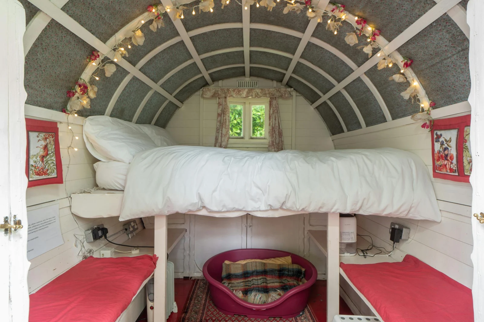 Sleeping platform with double bed, dog basket, benches with cushions