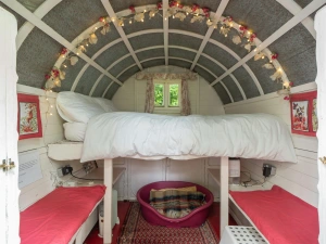 Sleeping platform with double bed, dog basket, benches with cushions