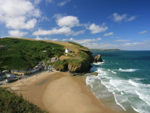 View from high above Llangrannog beach with village and houses to left sea to the right